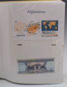 An amateur collection of around 150 world banknotes, in an album with labelled pages