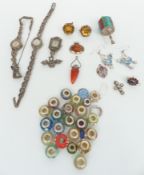 A collection of silver jewellery including two marcasite watches, pendants, beads, etc
