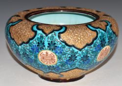 A continental pedestal bowl with enamelled and gilt Chinoiserie decoration, indistinct impressed