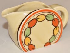Clarice Cliff for Newport Pottery Art Deco cream jug in the Oranges and Lemons pattern, H6.5cm