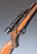Walther .22 bolt-action rifle with chequered semi-pistol grip, raised cheek piece, magazine,