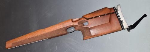 A fully adjustable wooden target rifle stock.