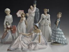 Six Lladro and Nao figures including sweethearts, girls with parasols etc
