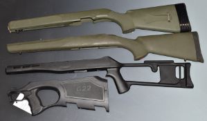 Four composite rifle stocks including one for a Walther G22 and one skeleton example.
