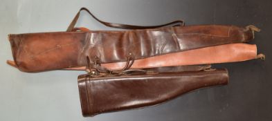 Three leather shotgun slips comprising one 'leg of mutton' (76cm long) and two wool lined.