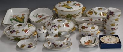 Approximately twenty five pieces of Royal Worcester oven and dinner ware decorated in the Evesham