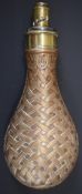 G & JW Hawksley copper and brass powder flask with basket weave decoration, 20.5cm long.
