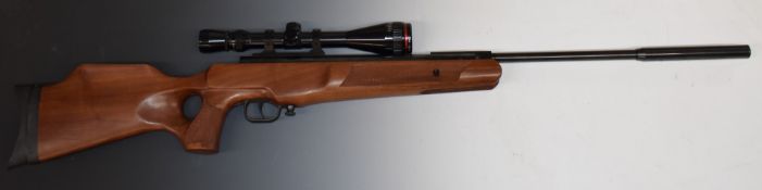 Theoben .22 air rifle with chequered thumb hole grip, raised cheek piece to the stock, chequered