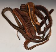 Six canvas and leather shotgun cartridge belts including 12 bore, 20 bore an .410 etc