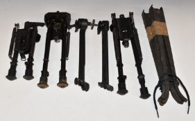 Seven various rifle bi-pods or mono-pods including three adjustable folding examples.