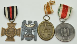 Two German WW2 Third Reich Nazi medals comprising Atlantic Wall and Volkspflege examples together