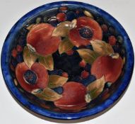 Moorcroft pedestal dish decorated in the Pomegranate pattern with two open pomegranates, H5 x D20.