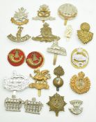 Nineteen cap and collar badges including 3rd Volunteer Battalion Sommerset Regiment, 6th Territorial