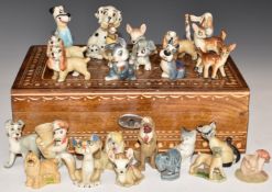 A collection of mostly Walt Disney Wade figures in a pokerwork box