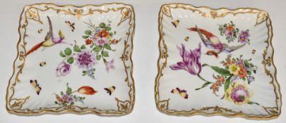 A pair of Chelsea style shallow dishes with bird of paradise decoration, impressed and gilded anchor