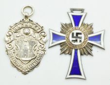 German Third Reich Nazi mother's cross dated 16th December 1938 to reverse, together with a