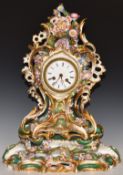 A 19th/20thC continental porcelain flower encrusted mantel clock and stand, H46cm