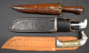 Three hunting knives comprising Buck 119 Bowie knife with 6 inch blade, a Mexican example with