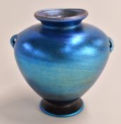 Louis Comfort Tiffany favrile glass vase in iridescent blue with loop handles, marked LCT Favrile to