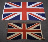Two Union flags, one cloth, stitched, 110 x 55cm, and a nylon example, 150 x 88cm
