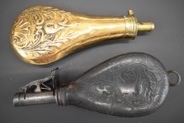 Copper and brass powder flask together with a leather shot flask, both with embossed decoration to