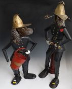Two modern metal figures of dogs as firefighters one with a bucket (H71cm) the other with a fire
