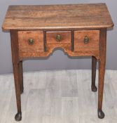 Georgian oak sidetable or lowboy with three drawers and shaped under stretcher W68 x D46 x H69cm