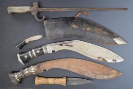 Two Kukri knives, one with 31cm blade with sheath and karoa, the other with 33cm blade, together