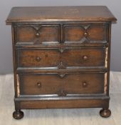 Carolean style oak bachelor's chest of drawers raised on bun feet, W76 x D44 x H76