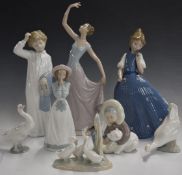 Eight Lladro and Nao figures, tallest 35cm