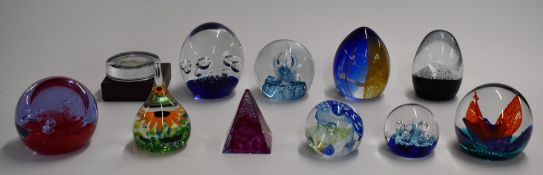 Eleven Caithness and similar glass paperweights including Buccaneer, Abseil and Quicksilver, some