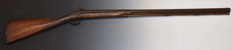 Unnamed percussion hammer action sporting gun with chequered grip, vacant cartouche to the wrist,