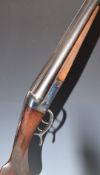 French 12 bore side by side action shotgun with scrolling trigger guard underlever, chequered semi-