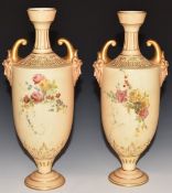 Pair of Royal Worcester blush ivory pedestal vases with twin mask handles, H27cm