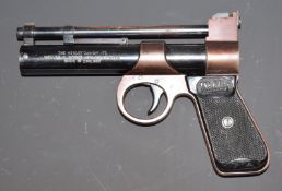 Webley Junior .177 air pistol with named and chequered grips, in wooden case.