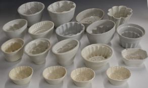 Eighteen vintage jelly moulds, tallest 15cm