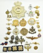 Small collection of badges including Royal Artillery, Royal Guernsey Regiment, Officers' Training
