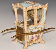 Dresden or similar porcelain sedan chair with drawer and upholstered interior, possibly a pin