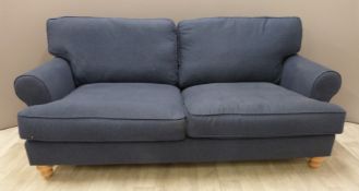 A modern navy three seat sofa on turned wooden feet, W180 x D93cm x H90cm
