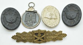 Five German WW2 Third Reich Nazi badges including Close Combat with F.E.C.W.E Peekhaus Berlin and