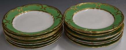 Sixteen Spode Felspar dinner plates with gilded decoration on a green ground, diameter 25cm