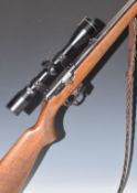 BRNO 511 .22 bolt-action rifle with chequered semi-pistol grip, magazine, pop-up sights, braided