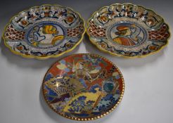 Three chargers comprising two large Italian and one Japanese Satsuma example, largest diameter 40cm