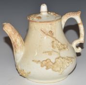 An 18th/19thC blanc de chine teapot with relief moulded decoration, H11cm