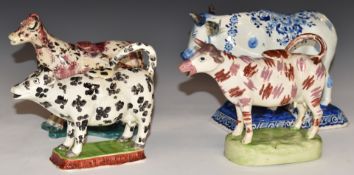 Three 18th/19thC Spongeware cow creamers and an 18thC Delft cow with milkmaid, signed Jacobus Holder