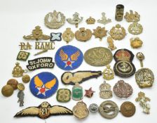Small collection of military and Civil Defence metal and cloth badges and insignia including ARP