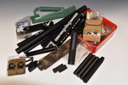 A collection of gun parts and accessories including air rifle sound moderators, Parker-Hale target