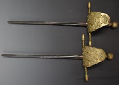 Pair of continental court/short swords with leather grips, leather backed guards and both with