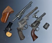 Four blank firing and replica revolvers and pistols including an Umarex 6mm Flobert Derringer with