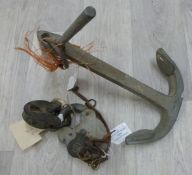 A  metal boat anchor together with two swing bridge padlocks and keys, one stamped Trade Mark.